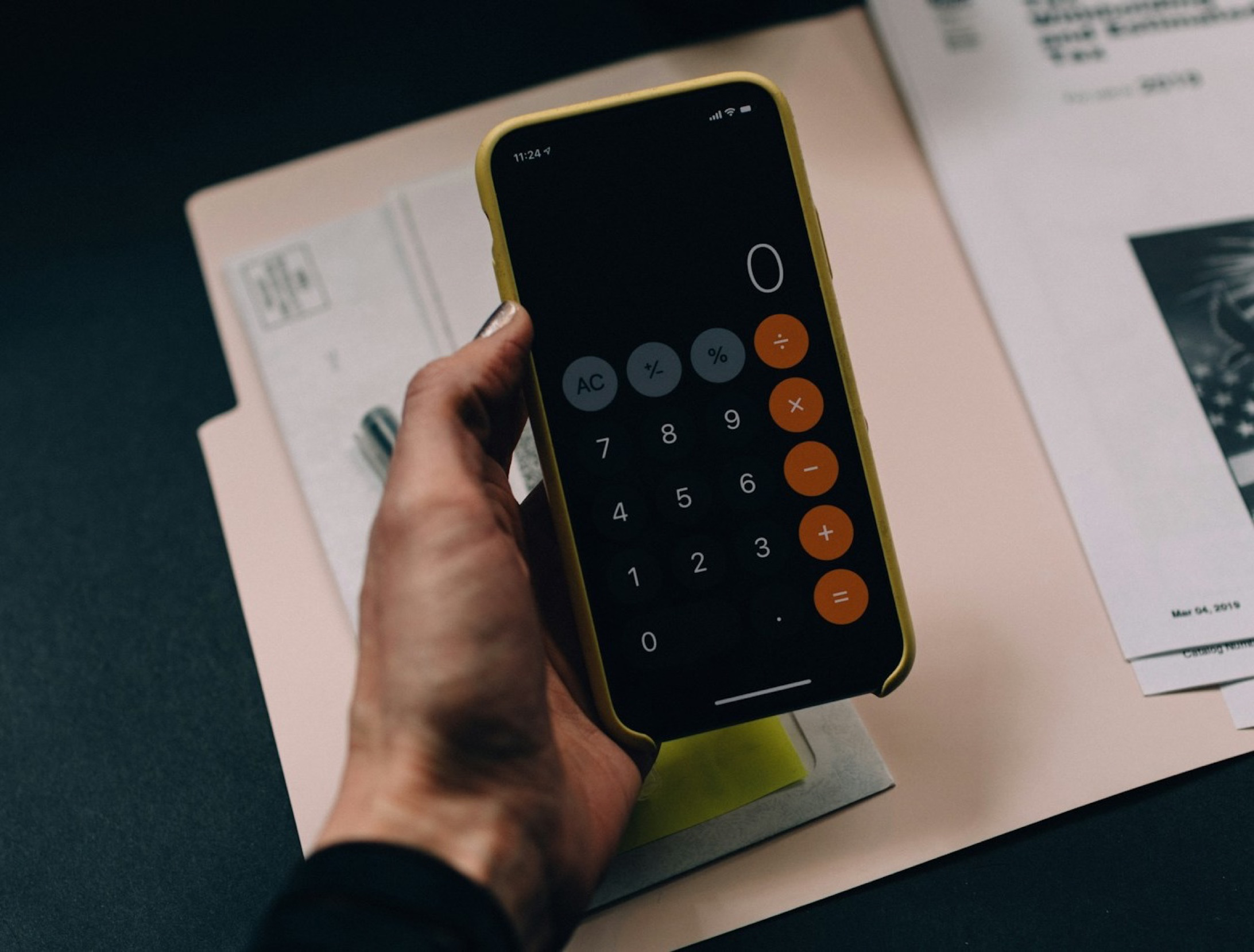 Employee reviewing monthly expenses on a smartphone
